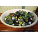 A LARGE SELECTION OF COLLECTABLE GLASS MARBLES housed in a Royal Worcester dish