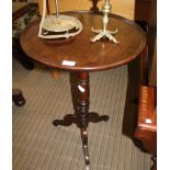 A 19TH CENTURY CIRCULAR SAUCER TOPPED TABLE on turned column and three short downswept legs