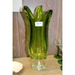 A MURANO "SWUNG" VASE, of amorphic form, lime green tinted with clear base 1960s, 40cm high