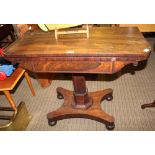 A 19TH CENTURY ROSEWOOD FOLDOVER SWIVEL TOPPED TABLE, on faceted column, supported on plinth base