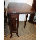 A FIRST-QUARTER 20TH CENTURY MAHOGANY FINISHED SUTHERLAND TABLE, having pierced slatted sides,