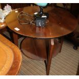 A RETRO CIRCULAR COFFEE TABLE on four plain legs with a circular undertier, together with a LOW