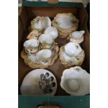 A BOX CONTAINING A VICTORIAN FLUTED PORCELAIN PART TEA SERVICE of apricot ground, together with a "
