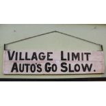 A NOVELTY PAINTED WOODEN HANGING SIGN bearing the legend "Village Limit, Auto's go Slow"