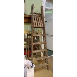 A VINTAGE SET OF WOODEN FOLDING STEPS