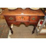 A LATE 18TH / EARLY 19TH CENTURY OAK SIDE TABLE with plain rectangular top, having single central
