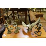 THREE PAIRS OF CAST BRASS CANDLESTICKS together with an eagle on a branch