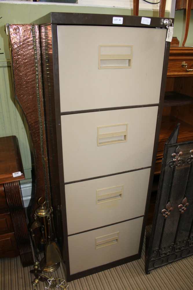 A TWO TONE STEEL FOUR DRAWER FREE-STANDING FILING CABINET