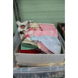 A CRATE CONTAINING A SELECTION OF COSTUME DOLLS OF THE WORLD together with other dolls clothing