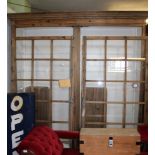 A LARGE PROBABLE CONTINENTAL SOFTWOOD DISPLAY UNIT, having two multi-panelled glazed doors,