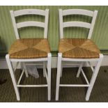 A PAIR OF RUSH SEATED WHITE PAINTED BAR STOOLS