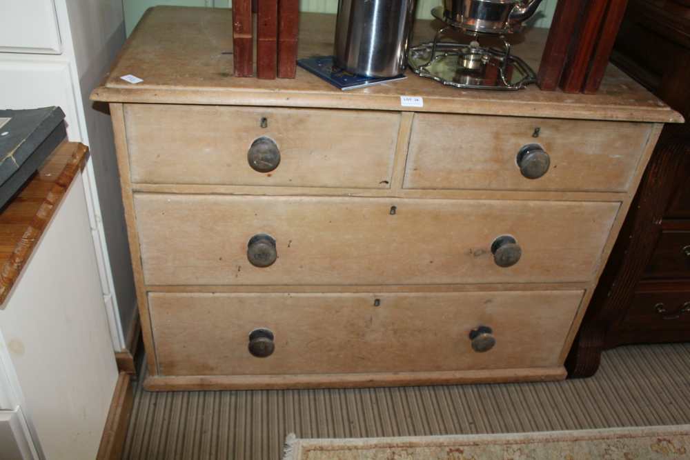 A 19TH CENTURY PINE FOUR DRAWER CHEST