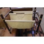 A TWIN COMPARTMENT MAGAZINE RACK of rustic construction