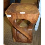 A CARVED WOODEN MODERNIST STOOL