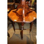 AN EARLY 20TH CENTURY MAHOGANY OCTAGONAL TOPPED OCCASIONAL TABLE on four turned legs, united by "