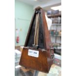 A WOODEN CASED CLOCKWORK METRONOME with bell