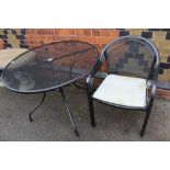 A METAL MESH FINISHED PATIO SUITE comprising; circular topped table and two tub armchairs