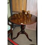 A 19TH CENTURY MAHOGANY CIRCULAR TOPPED TABLE with birdcage action, supported on baluster turned