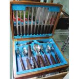 A CANTEEN CONTAINING A SELECTION OF DESIGNER WOODEN HANDLED CUTLERY