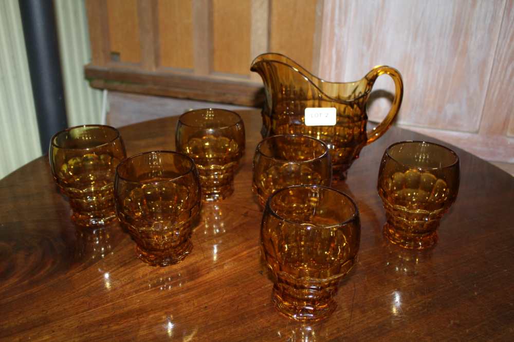 A CZECHOSLOVAKIAN AMBER GLASS LEMONADE SET, in the Jacobean pattern, by "Josef Inwald", from the