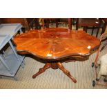 AN ITALIAN INLAID FANCY SHAPED TOPPED COFFEE TABLE on baluster carved column and four downswept legs