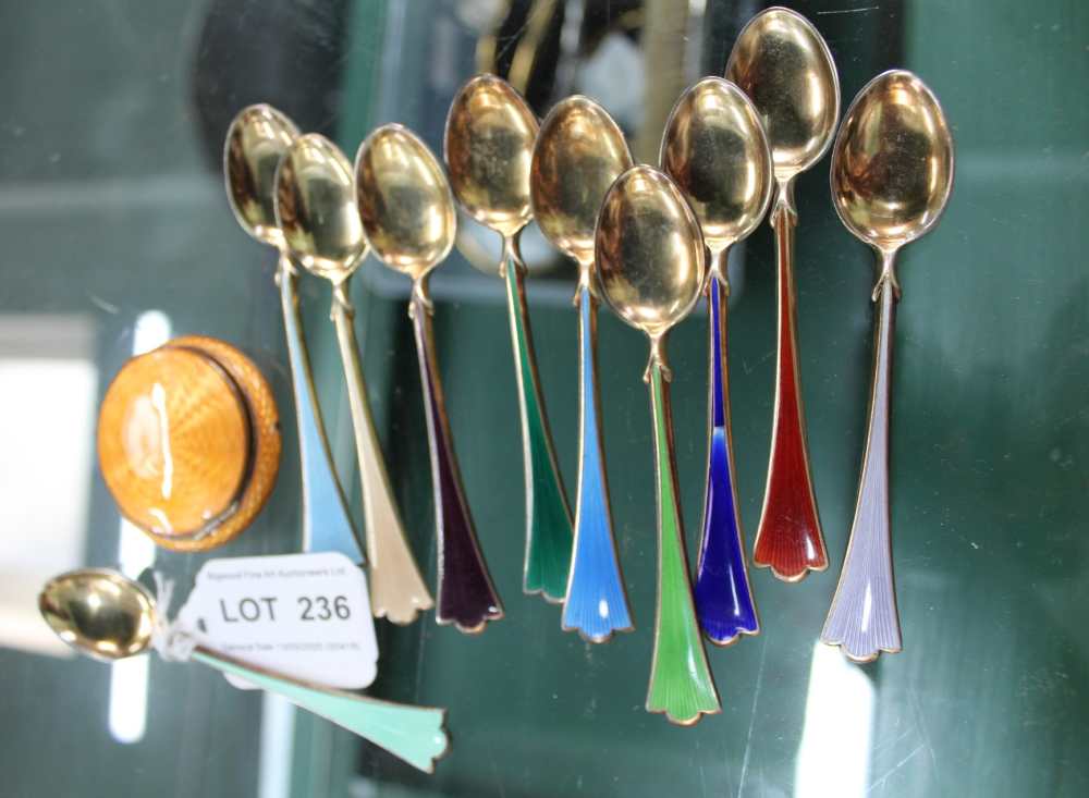 A SELECTION OF NORWEGIAN ENAMELLED DEMITASSE SPOONS AND A SMALL SIZED COMPACT