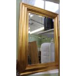 A FANCY PLAIN GILT FRAMED BEVEL PLATE WALL MIRROR