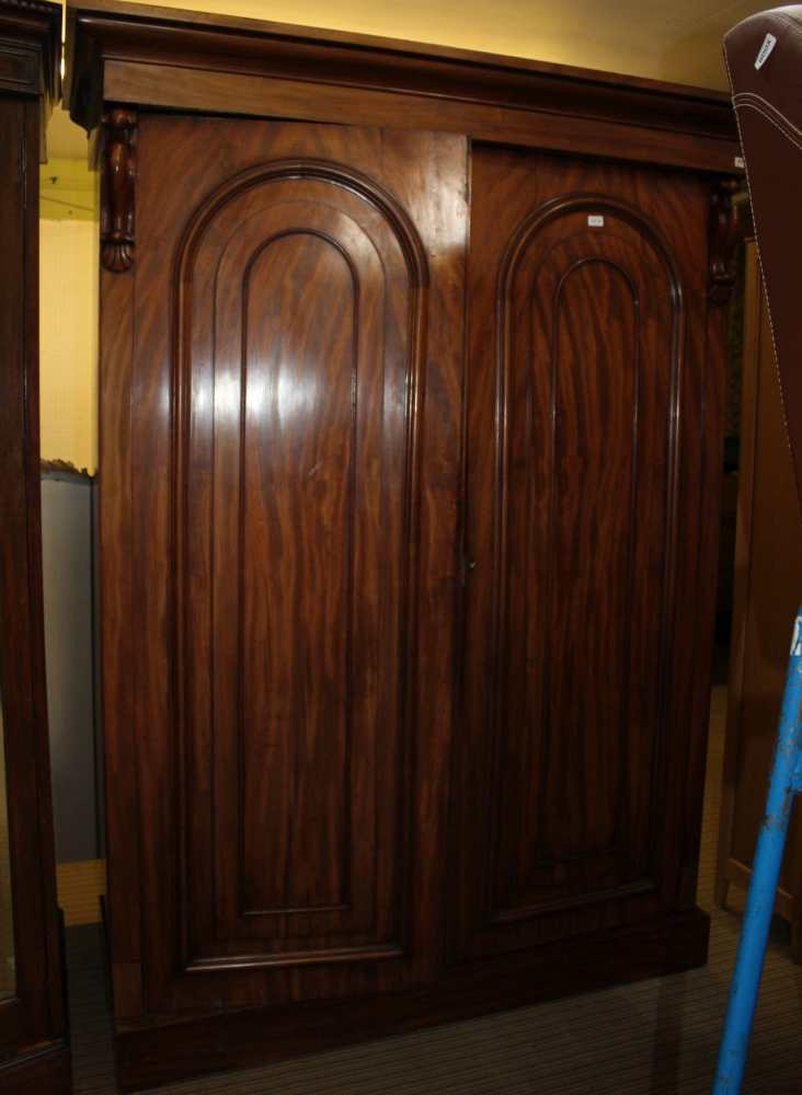 A LATE 19TH CENTURY MAHOGANY FINISHED TWO DOOR COMPACTUM WARDROBE with well fitted interior