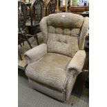 A FAWN TEXTURED BUTTON BACK UPHOLSTERED MANUALLY RECLINING ARMCHAIR