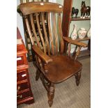 A 20TH CENTURY BEECH WOOD SLAT BACK COUNTRY KITCHEN ARMCHAIR with solid seat