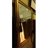 A GILT FRAMED BEVEL PLATE WALL MIRROR