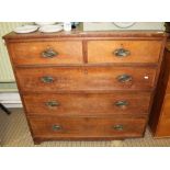 A 19TH CENTURY OAK CHEST OF FIVE DRAWERS having crossbanded top, two inline and three full width