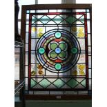 A WOODEN FRAMED LEADED GLASS PANEL some coloured, some textured, some painted