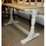A RECTANGULAR SCRUB TOPPED KITCHEN TYPE TABLE on later painted base, having twin turned columns,
