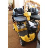 A YELLOW AND BLACK FINISHED RECHARGABLE MOBILITY SCOOTER BY KYMCO with charger and instruction