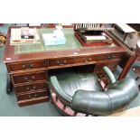 A GREEN LEATHERETTE CAPTAINS STYLE OFFICE CHAIR sold together with a reproduction twin pedestal desk