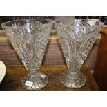 A PAIR OF CUT GLASS TRUMPET SHAPED VASES, on star cut pedestal foot, 29cm high