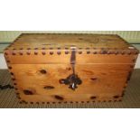 A STUDDED PINE BOX CHEST with iron work lock, and carry handles