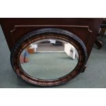 A FANCY FRAMED OVAL BEVEL PLATE WALL MIRROR