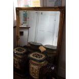 A LARGE FANCY GILT FRAMED BEVEL PLATE WALL MIRROR