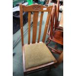 A PAIR OF OAK DINING CHAIRS with drop in seat pads