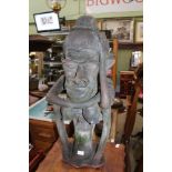 A STYLISED PATINATED CAST TERRACOTTA FEMALE FIGURINE of ethnical origin