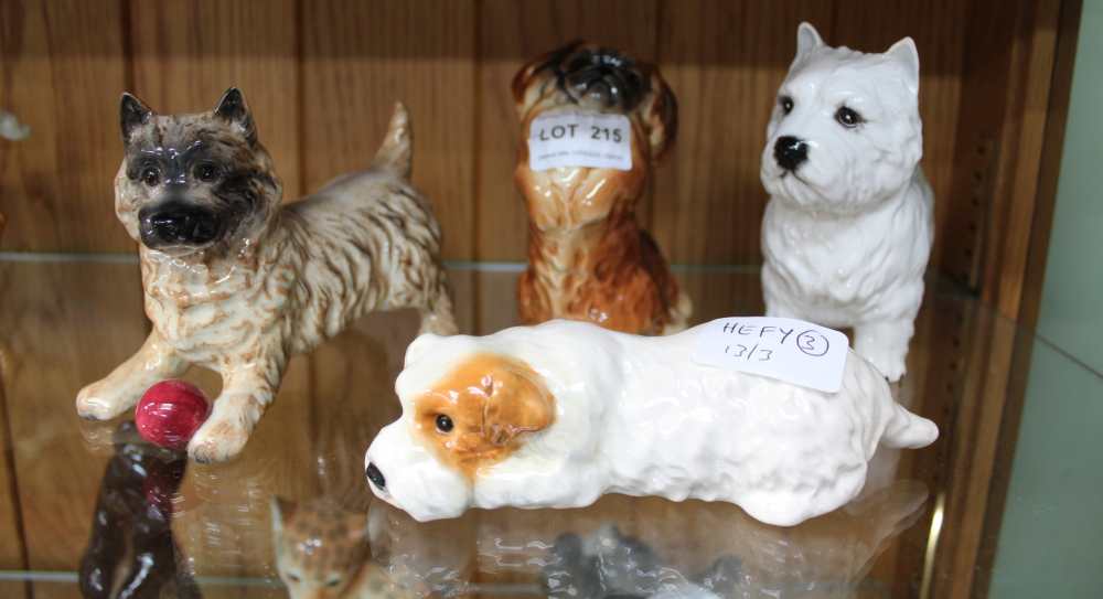 FOUR VARIOUS BESWICK BRANDED DOGS