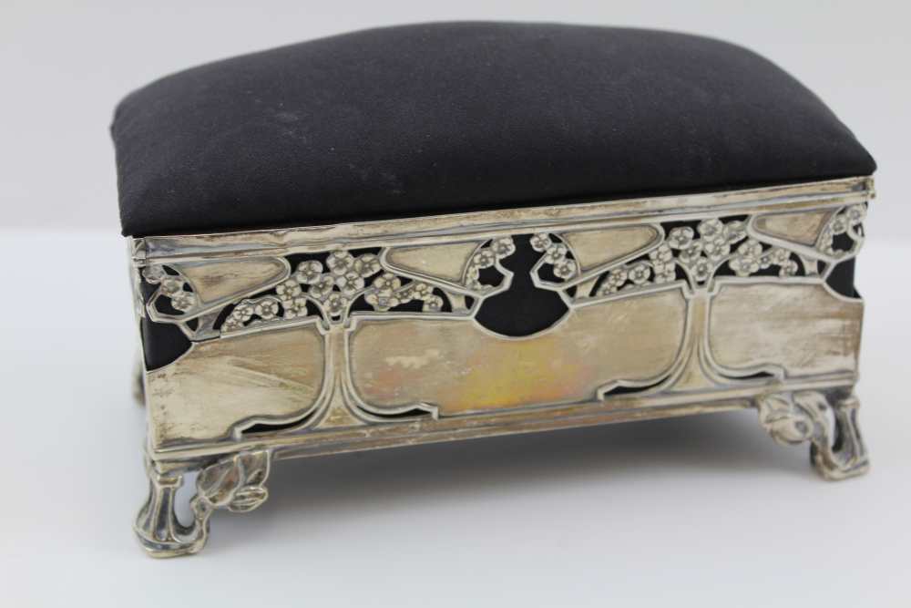 AN EDWARDIAN SILVER TABLE CASKET, of Art Nouveau form, tree design to the sides, raised on