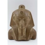 AN EGYPTIAN RED GRANITE CARVED PHARAONIC HEAD featured with Horus upon his head cowl, wings