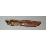 A MID-20TH CENTURY EUROPEAN HUNTING KNIFE with deer slot handle, the blade engraved "Schneidteufel