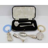 A SELECTION OF SILVER ITEMS to include a silver baby spoon and pusher 1928, a similar cased set