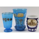 THREE 19TH CENTURY BOHEMIAN SPA GLASSES, two with pale blue ground, one with gilded architectural