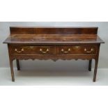 A LATE 18TH / EARLY 19TH CENTURY LOW DRESSER, having plain plank top, with associated upstand, two