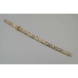 A JAPANESE SWORD with decoratively carved bone handle and scabbard, overall 81cm, (blade 43cm long)